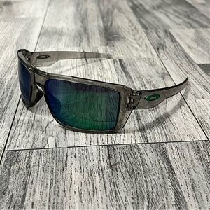 Oakley Double Edge Transparent Frame Sunglasses with Blue-Green Lenses